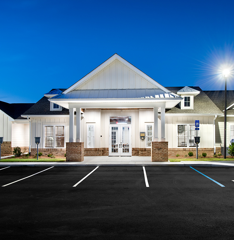 contact-image-1 Encore at Beacon Place Single Story Apartments - Luxury Exterior View Nighttime